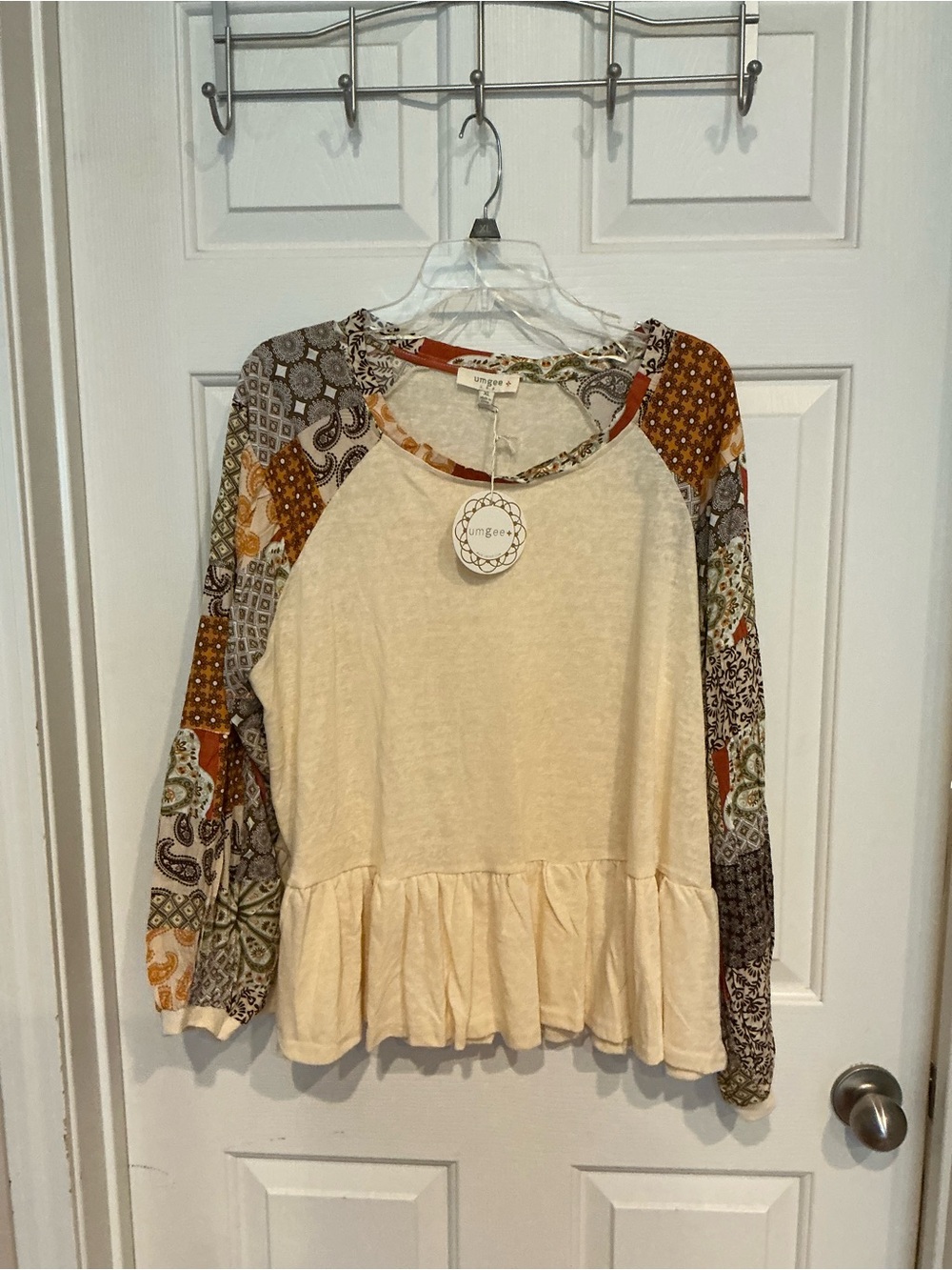 Umgee Cream Peplum Top with Multi-Print Raglan Sleeves